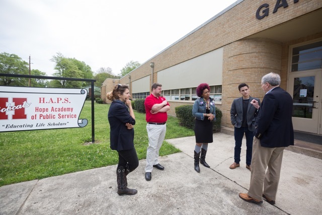Clinton school dean views research