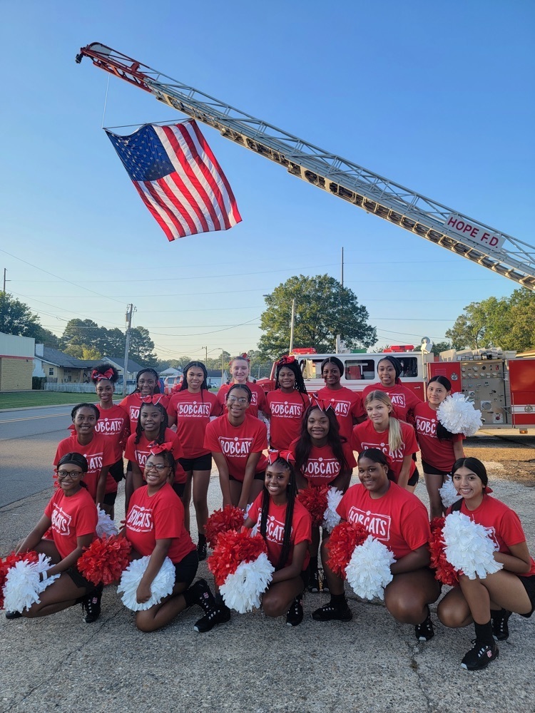 cheerleaders with fire truck